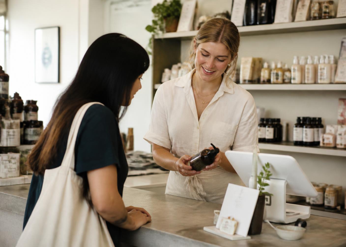 Store associate helping a customer at the counter
